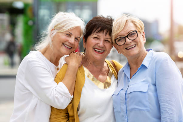 istock Three senior female friends having good time together 1256339245
