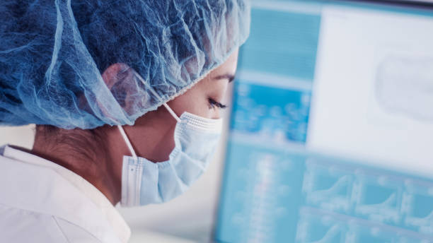 istock Female scientist working with biohazardous sample. Water flea daphnia on Computer Screen 1256339361
