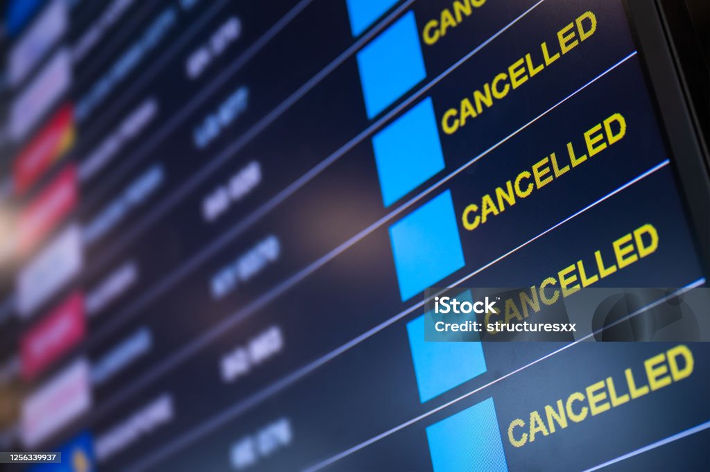 Airport lockdown, Flights cancellation on time table Airport lockdown, Flights canceled on information time table board in the airport while coronavirus outbreak pandemic issued around the world Cancellation Stock Photo