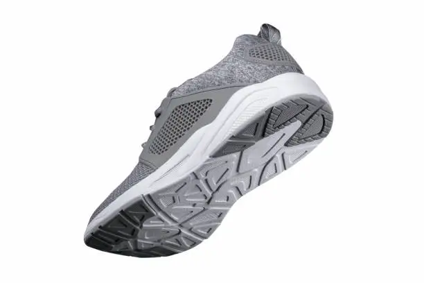 Sport shoes. Gray sneaker made of fabric with leather accents.