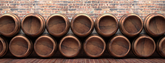 Winemaking, wine storage concept. Old barrels stacked on wooden floor, vintage brickwall background, banner. Beer, alcohol, whiskey cellar. 3d illustration