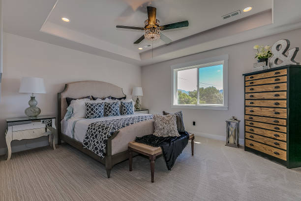 istock Luxury bedroom with tray ceiling and fan 1256345254