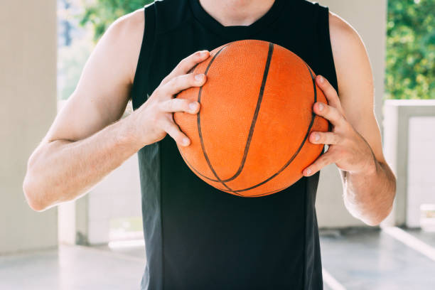 istock basketball player holding the ball 1256345461