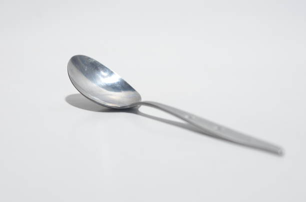 istock High Angle View Of Spoon On White Isolated Background 1256348217