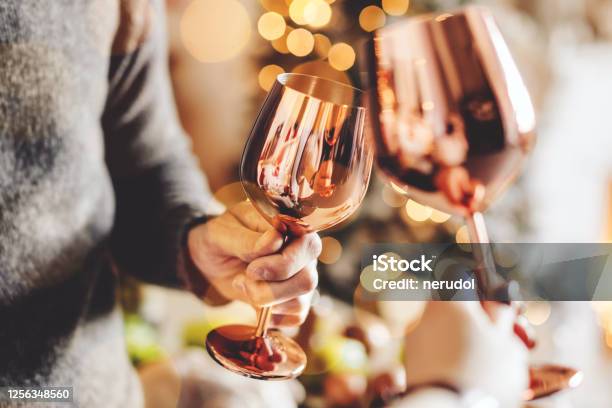 People Clink Glasses And Celebrating Stock Photo - Download Image Now - Celebratory Toast, Christmas, Adult