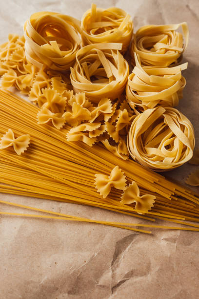istock Spaghetti, farfalle and tagliatelle isolated on a white background. 1256349275