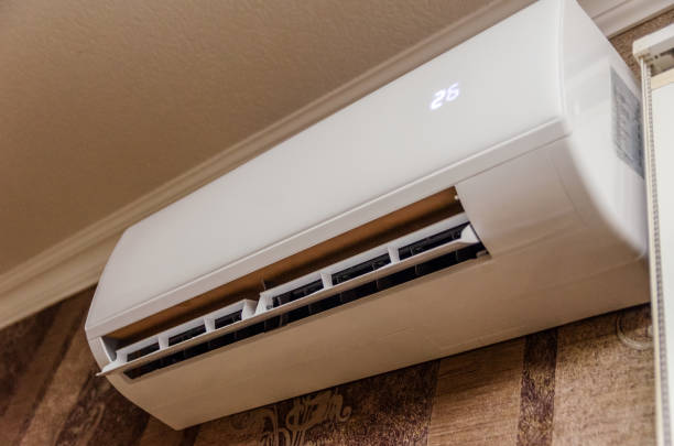 istock Air conditioning on a dark wall close-up, temperature 26 1256350823