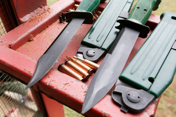Patrons and knives lie on the table in the dash.