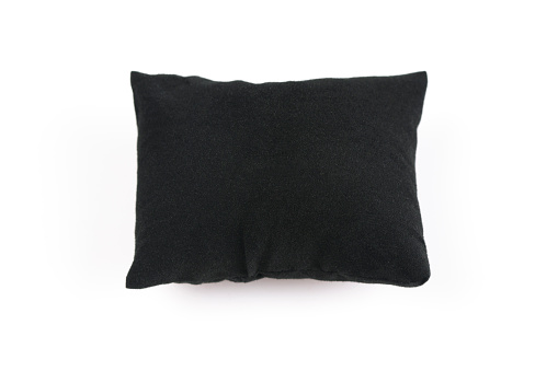 Black pillow isolated on white background
