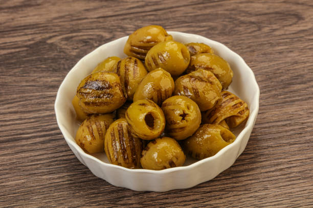 istock Green grilled olives in the bowl 1256352634
