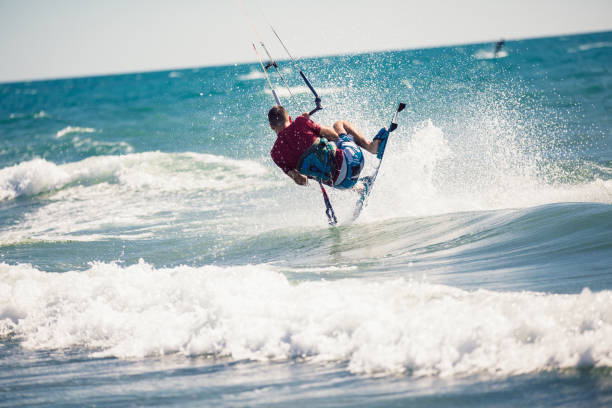 istock Professional kiter makes the difficult trick on a beautiful background. 1256352915