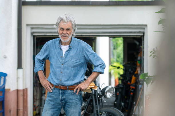 istock Senior adult with motorcycle 1256353251