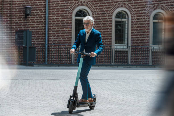 istock Senior Businessman on e-Scooter 1256353947