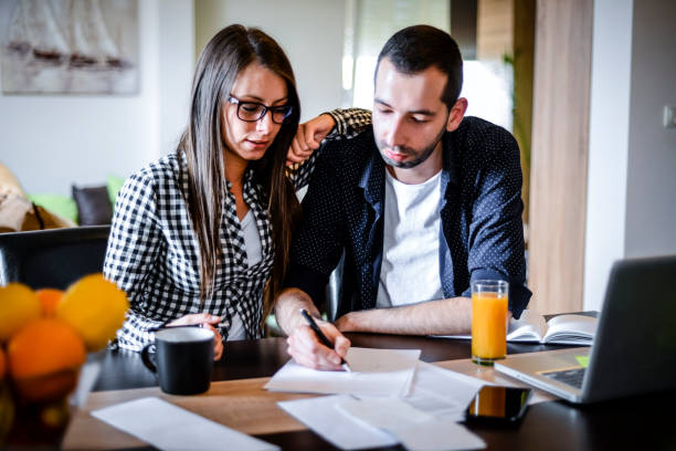 istock Young couple works from home 1256355691