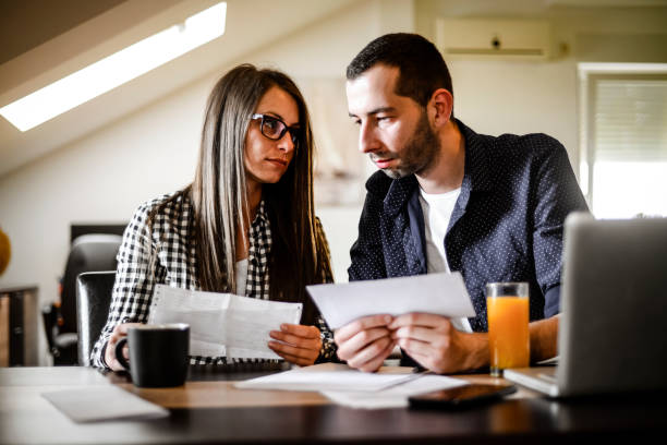 istock Young couple works from home 1256355712