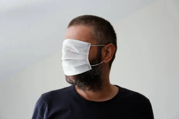 Photo of Man with surgical mask over the eyes