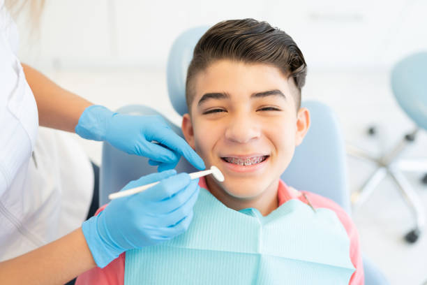 istock Boy With Braces At Orthodontic Center 1256361573