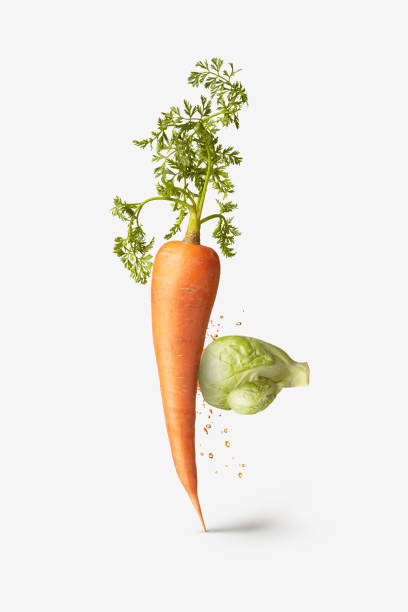 istock Natural cabbage as a boxing glove is punching carrot vegetable. 1256362775