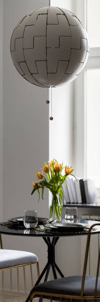 istock Stylish pendant lamp above table, panorama 1256362880