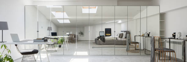 istock Attic bedroom with mirrored wardrobe, panorama 1256362885