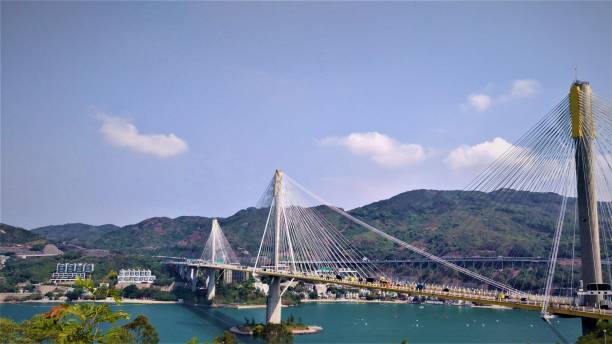 istock Large suspension bridge over a river in Hong Kong 1256366105