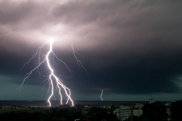 istock strong storm with amazing and dangerous lightning at night 1256366384
