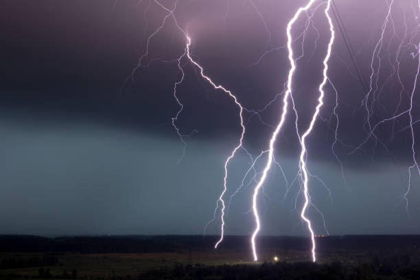 istock strong storm with amazing and dangerous lightning at night 1256366455