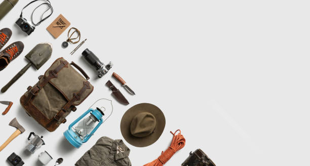 istock Top view of hiking and camping items arranged on abstract white background with empty space 1256366705
