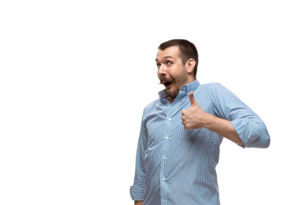 istock Young caucasian man with funny, unusual popular emotions and gestures isolated on white studio background 1256368450