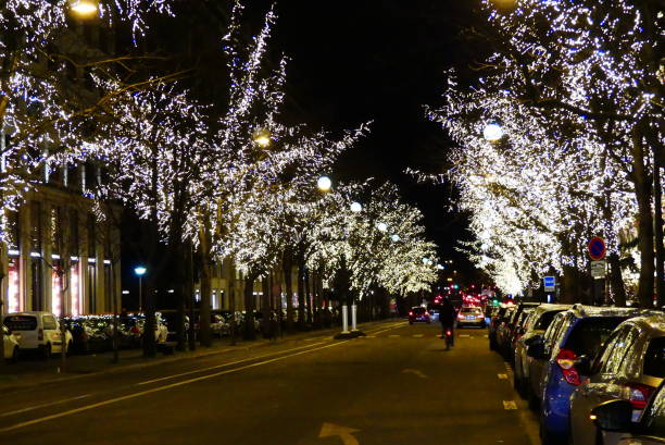 Avenue Montaigne by night in Paris stock photo