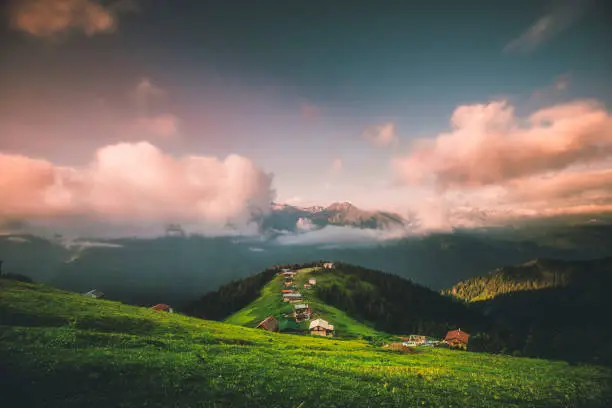 Landscape view of beautiful sunrise time with moody dramatic sky on the Pokut Highland in Çamlıhemşin, Rize in Blacksea region of Turkey on sunny summer morning