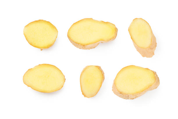 istock sliced ginger roots isolated on white background. Top view 1256376069