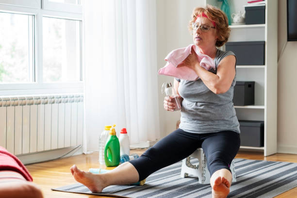istock Senior women exercise at home 1256376845