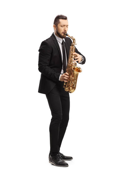 istock Elegant man in a suit playing a saxophone 1256376930