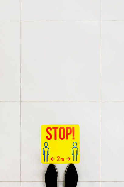 istock Stop point for customer to keep distance in the supermarket, to avoid spreading illness during transmission of COVID-19. Social distancing. Copy space, top view. 1256376956