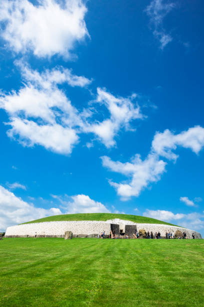 County Meath, Ireland - June 1, 2016. Tourists at Newgrange in County Meath, Ireland. It was built during the Neolithic period, around 3200 BC.