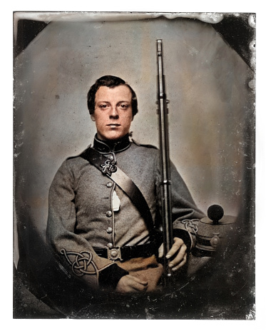 Vintage Colourised historical photo of soldier holding rifle, c. 1860s