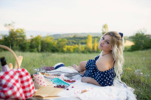 istock picnic in nature two girls 1256378182