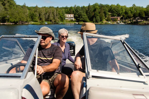 istock 50+ friends enjoying vacations on a small boat. 1256378439