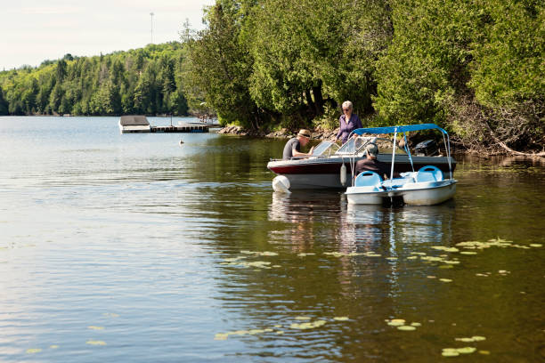 istock 50+ friends enjoying vacations on a small boat. 1256379096