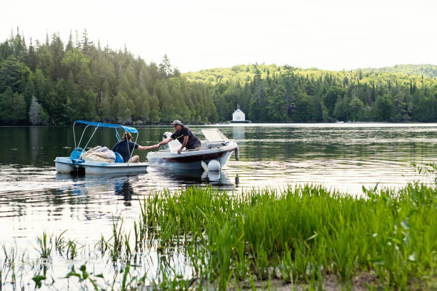istock 50+ friends enjoying vacations on a lake. 1256379247