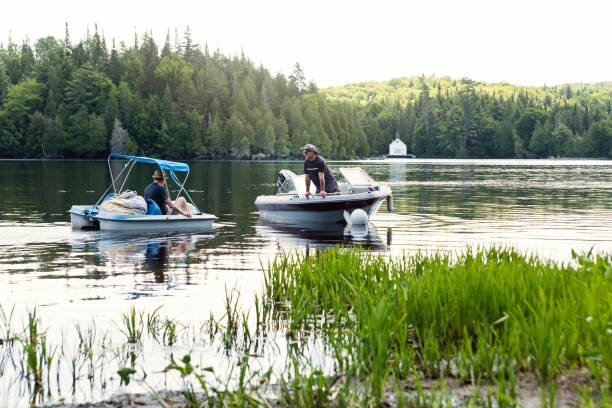 istock 50+ friends enjoying vacations on a lake. 1256379278