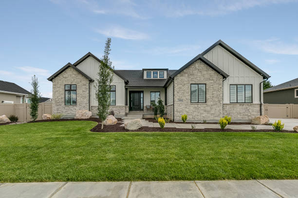 istock Traditional modern home with beauifully landscaped front yard 1256381137
