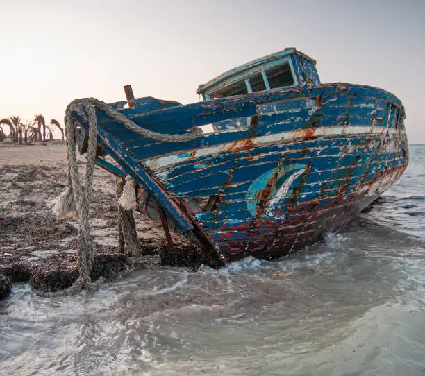 Photo of Old wrecked boat on the beach