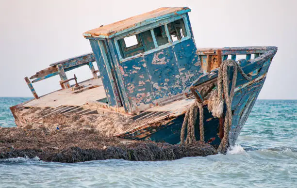 Photo of Old wrecked boat on the beach