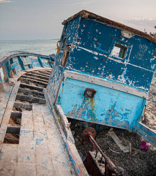 istock Old wrecked boat on the beach 1256382164