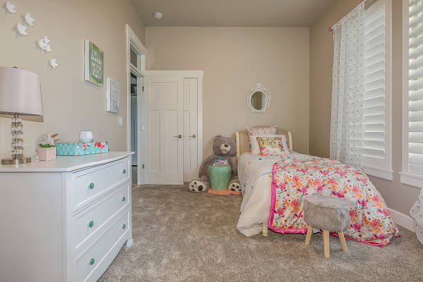 istock Staged bedroom with pink and white shades 1256382480