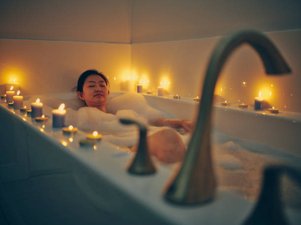 istock Japanese Woman Taking a Candlelight Bath 1256383172