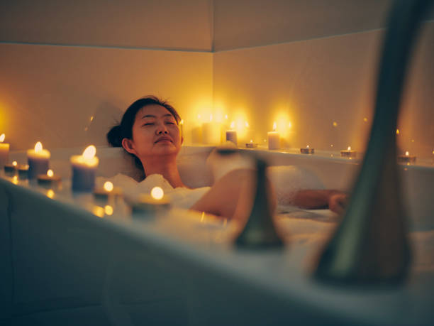 istock Japanese Woman Taking a Candlelight Bath 1256383181