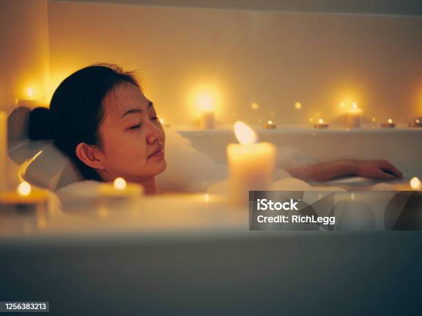 Japanese Woman Taking A Candlelight Bath Stock Photo - Download Image Now - Bathtub, Relaxation, Women